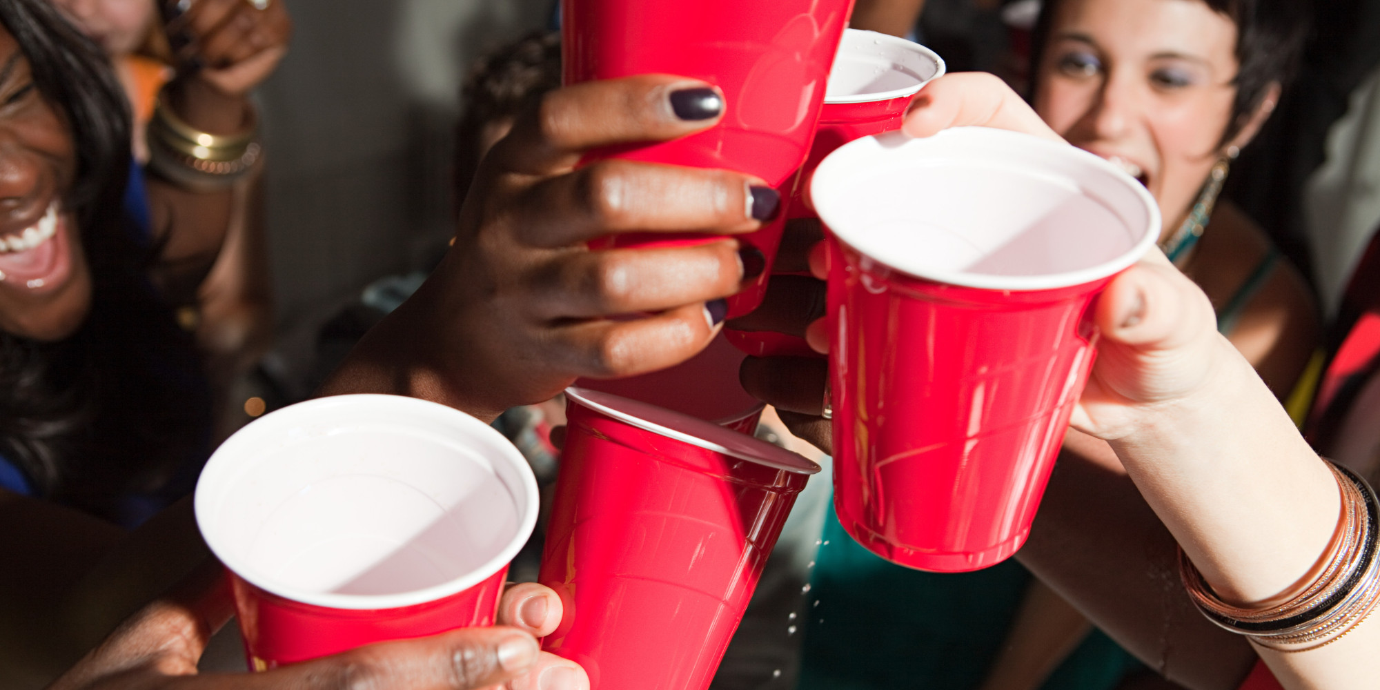 Young people with plastic cups at party